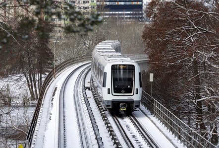 a train on a track in the snow