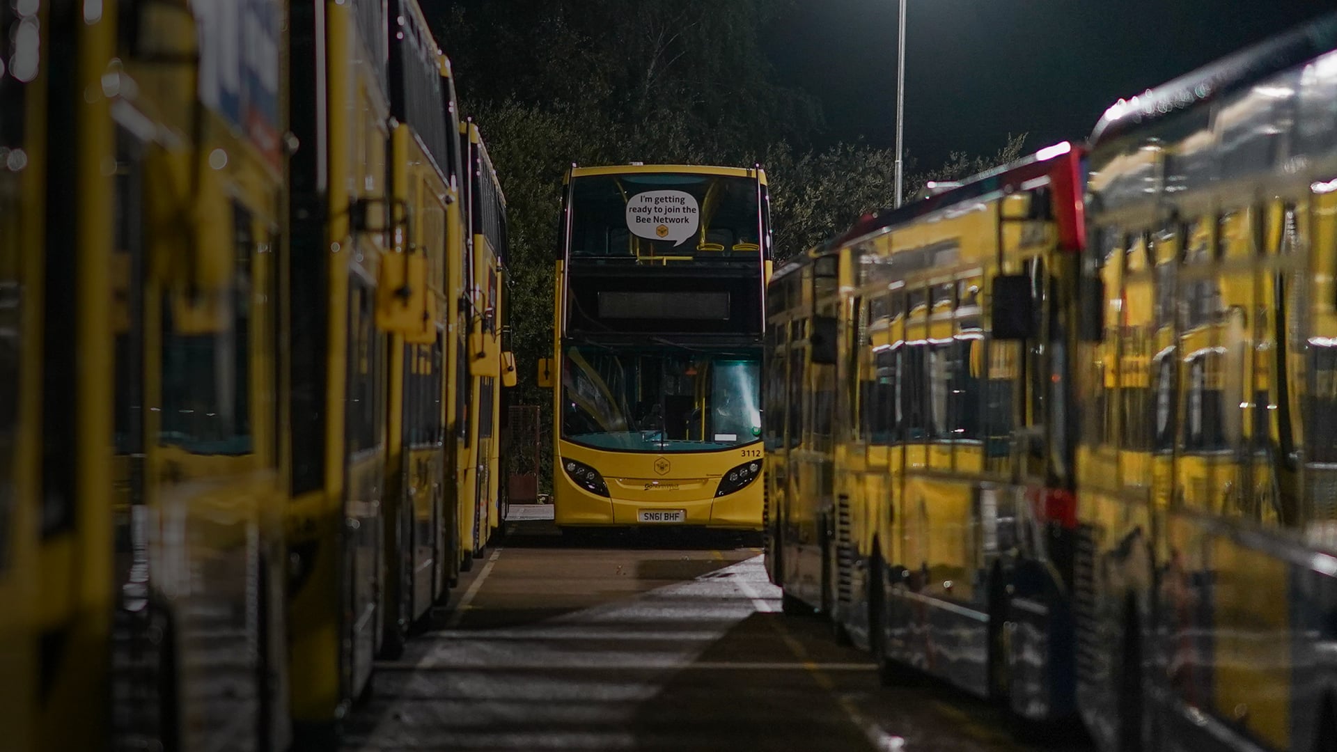 a double decker bus parked in a row